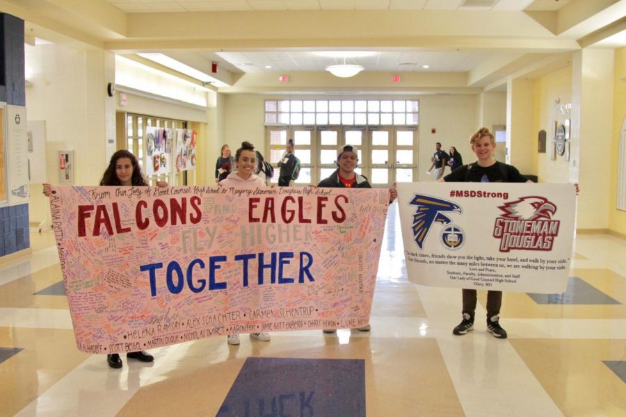 The+Good+Counsel+community+came+together+and+signed+a+banner+on+February+23rd++to+show+support+for+the+students+of+the+Majority+Stoneman+Douglas+High+School+shooting.+