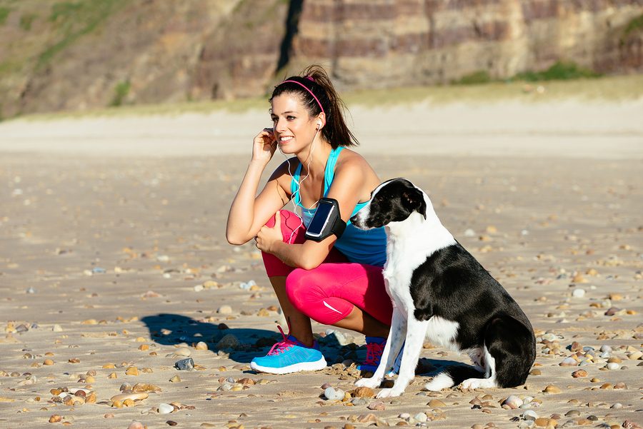 Relaxed+fitness+woman+with+dog+