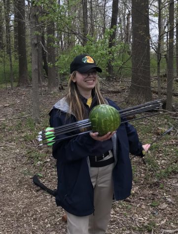 PJ Maneval ‘23 after shooting a watermelon with the GC Archery Club.