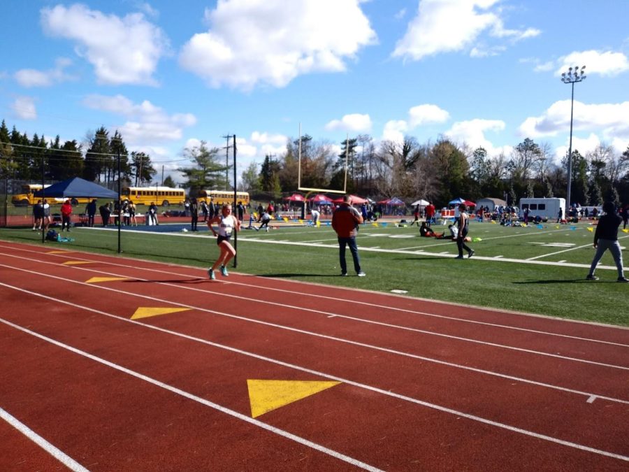 Leah Stephens leads the 3200-meter run to break both the Bullis Bulldog Invitational and Good Counsel records.