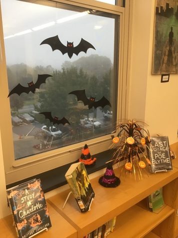 Halloween decorations on the library window during a foggy morning. 
