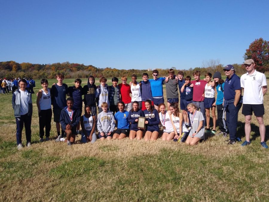 The cross country team gathers after the WCAC championship at Kenilworth Park.
