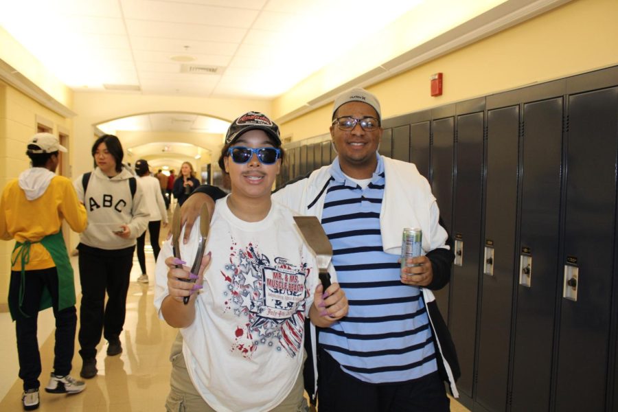 Photography co-editor Evan Brown 25 and a friend dressed as BBQ dads during spirit week