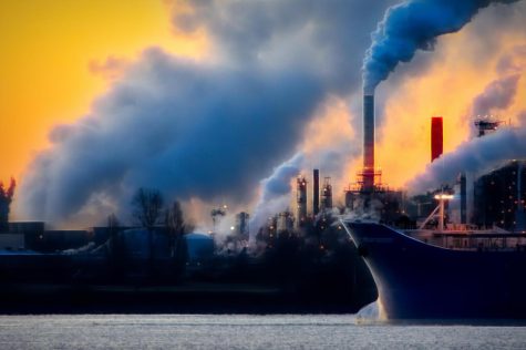 Greenhouse gas emissions from factories trap heat and warm the planet. 