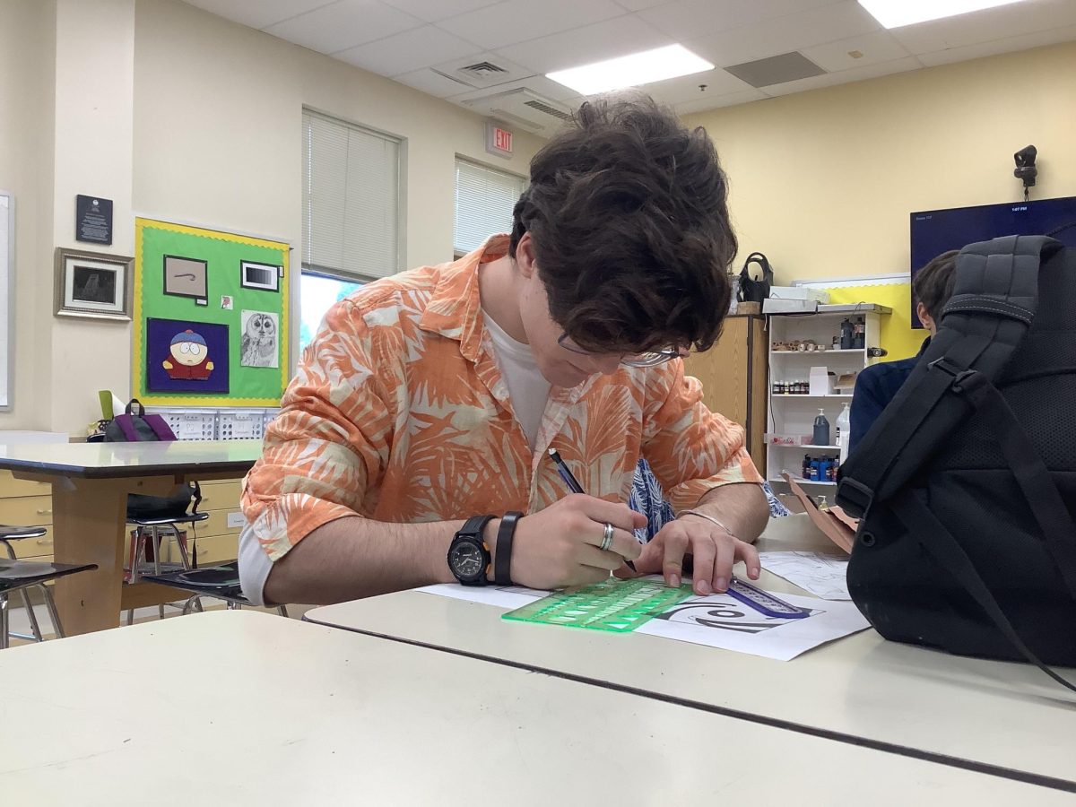 Matthew Niebur ‘25 taking free time to finish a masterpiece for honors drawing.