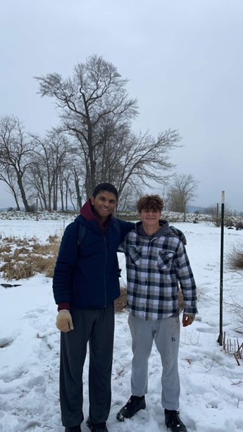Adrian Font ‘26 (right) with Danny Chung-A-Fung ‘24 (left, one of the retreat leaders) at the Little Portion Farm.