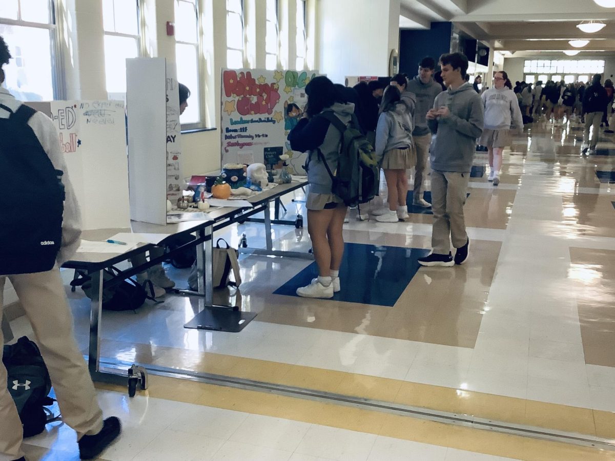 Students signing up for clubs in the Gallery in Good Counsel's 2024 Club Fair