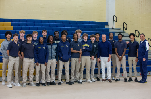 Chris Herren with the boys basketball after his talk with the student body.