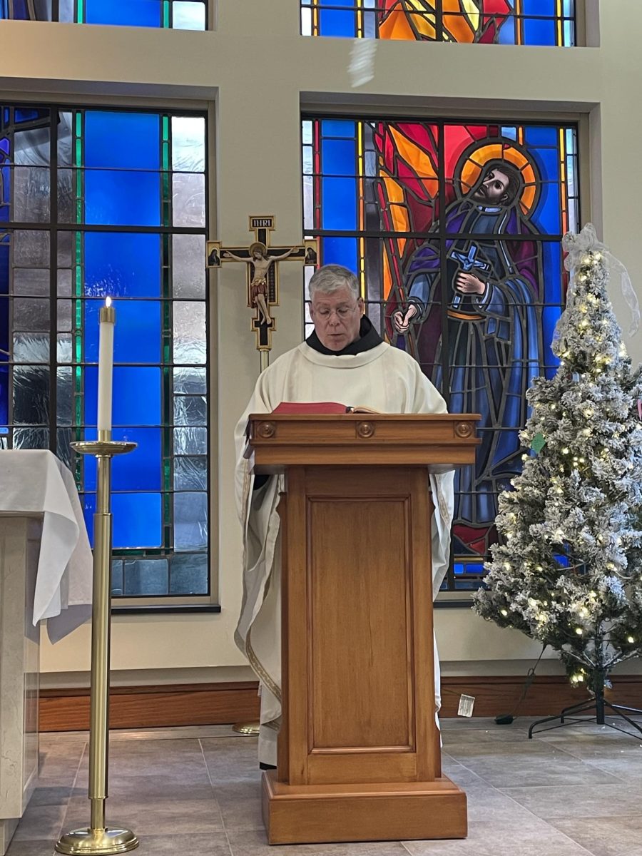 Father Tom Lavin shares the Gospel during Mass.