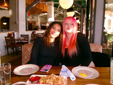 Catalina Coots ’27 and Luna Houweling enjoy a lighthearted moment while participating in the French exchange visit.