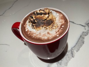 Traditional hot chocolate topped with a little twist of marshmallow fluff for the winter season!
