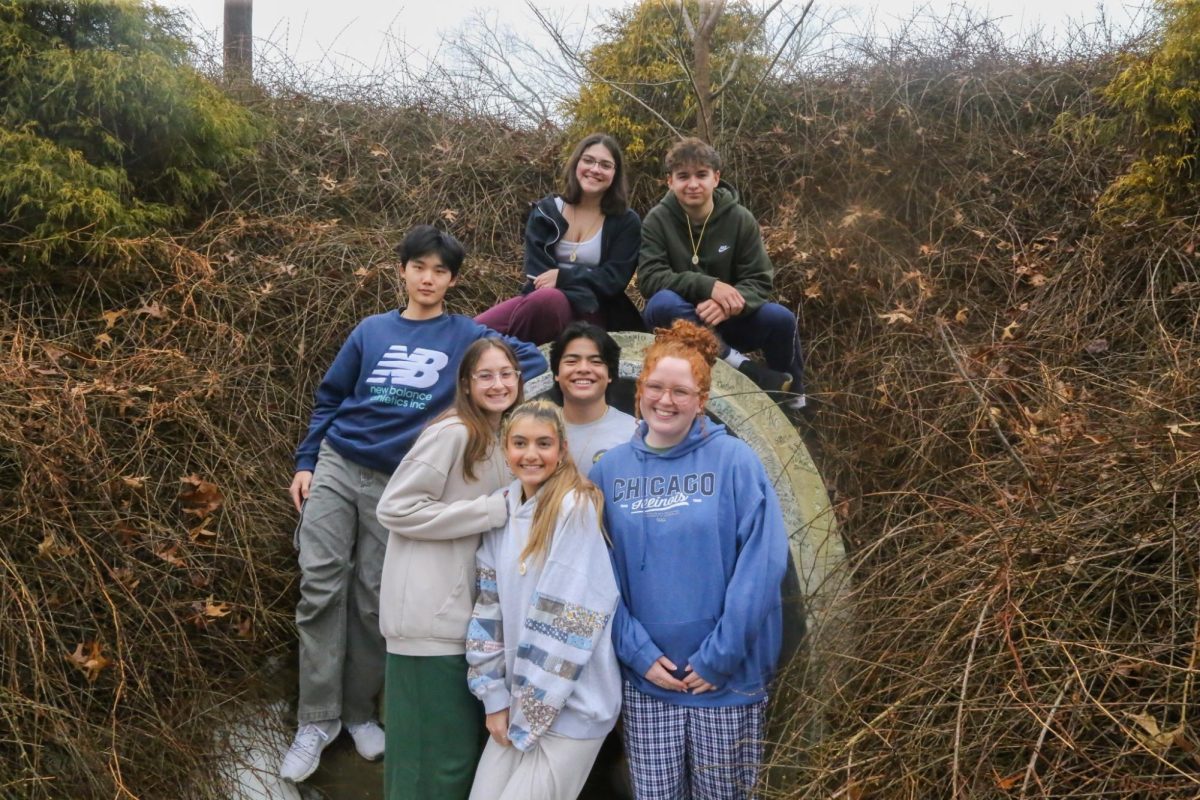 A small group takes a photo with their senior leader by the tunnel. Left to right: (top row) Morgan Slattery '27, Liam Sonner '27, (bottom row) William Xiao '27, Katerina Patrikis '27, Kate Krimigis '27, Gavin Cahanding '27, Maggie Friel '26